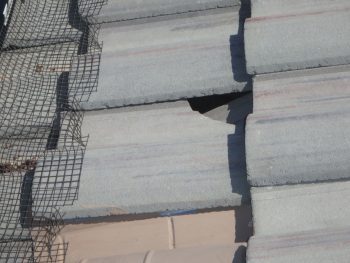 Damaged roof tile
